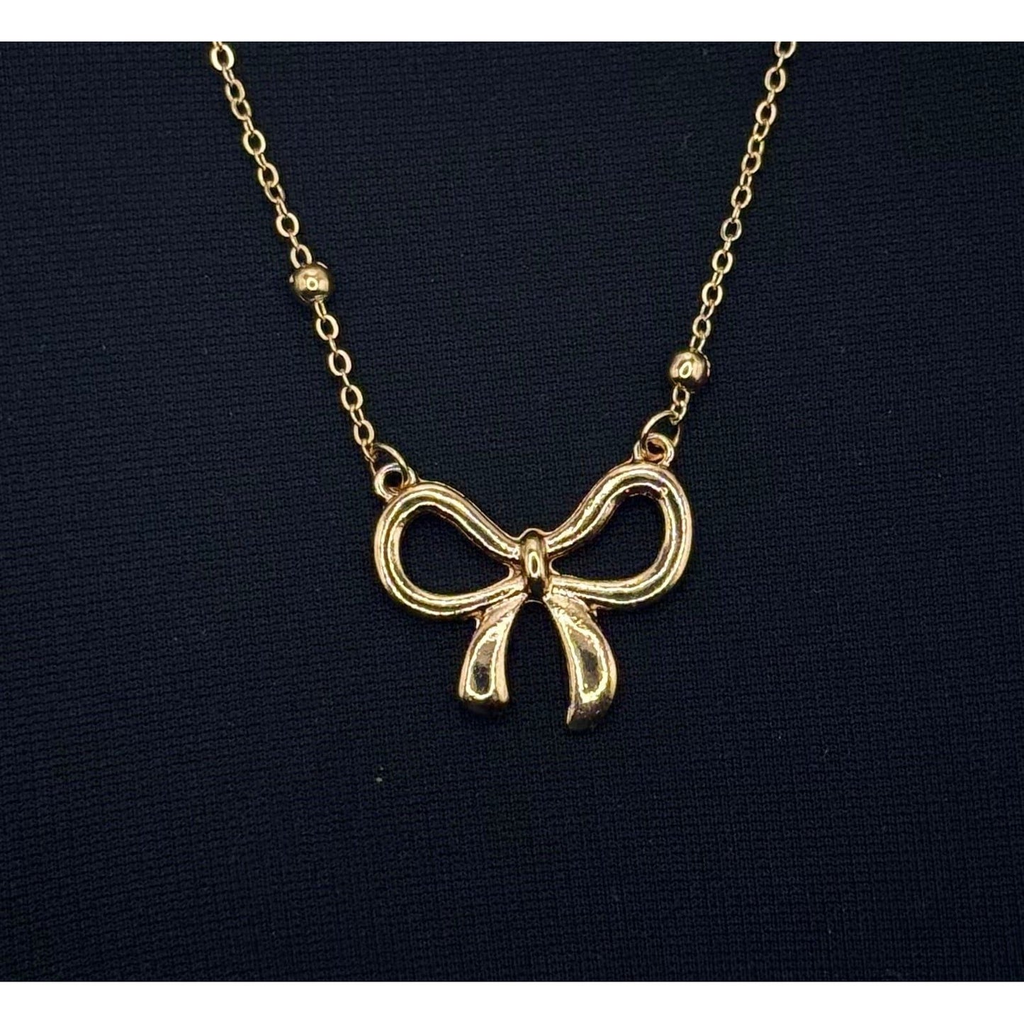 The Smiley Face Boutique Golden Bow Necklace π