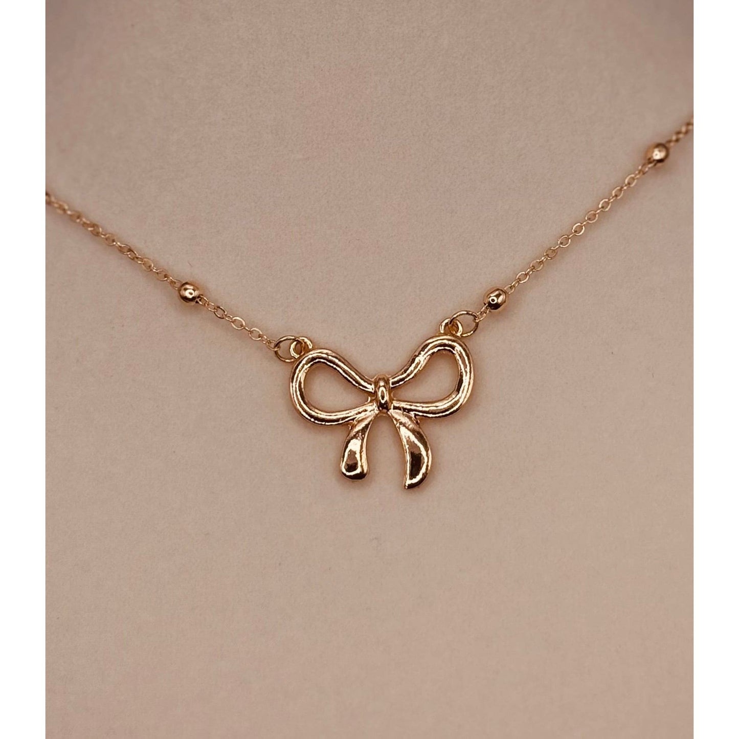 The Smiley Face Boutique Golden Bow Necklace π