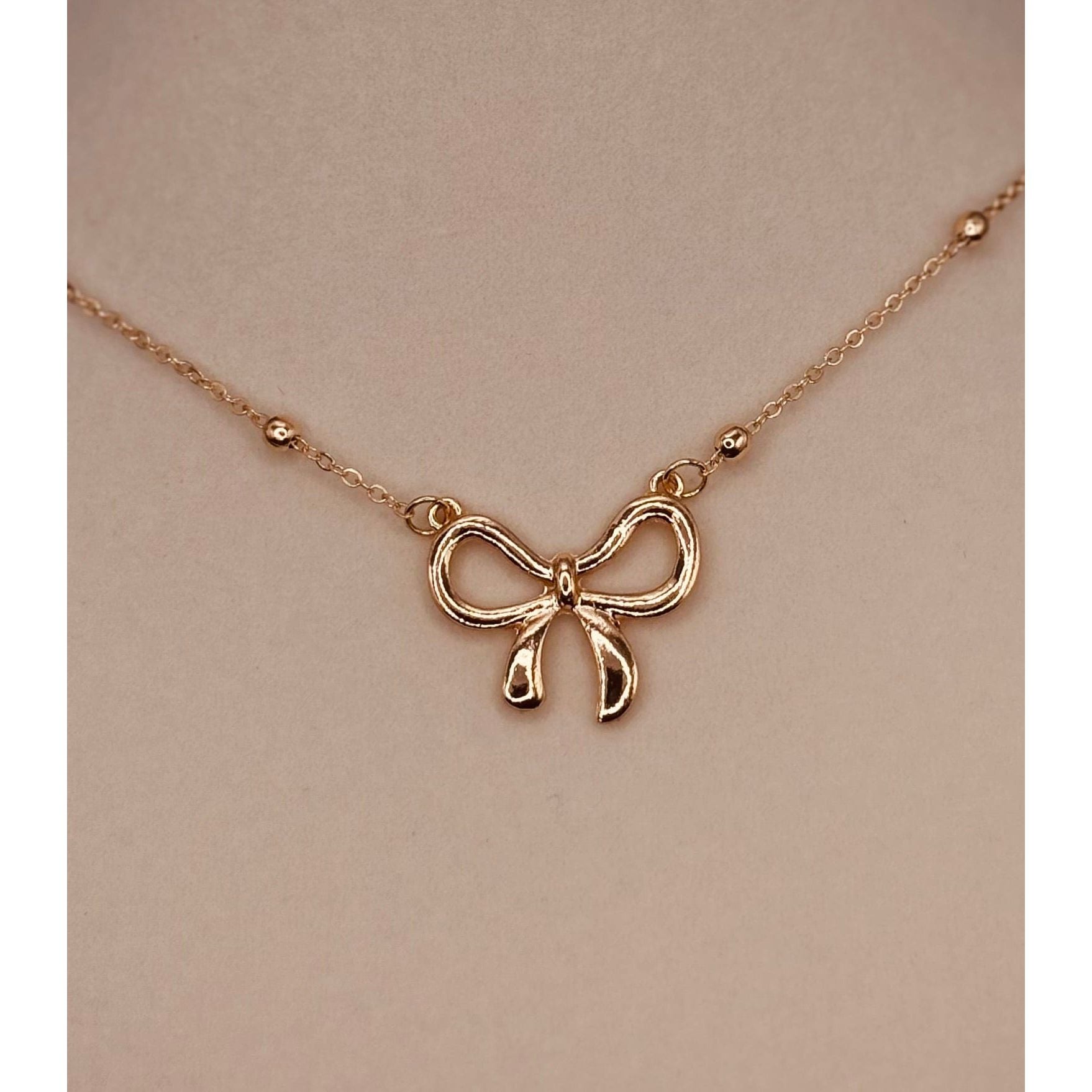 The Smiley Face Boutique Golden Bow Necklace 🎀